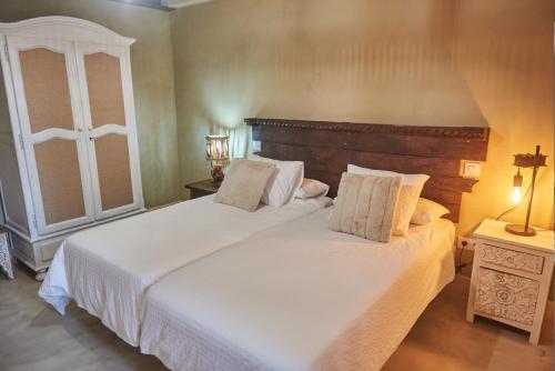 En eller flere senge i et værelse på MIRADORIO RURAL BOUTIQUE Apto MAR DE FONDO