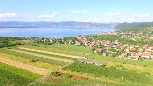 an aerial view of a town next to a body of water at Od svitanja do sumraka in Golubac