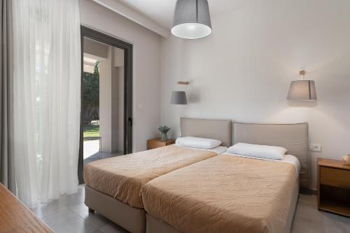 Cama o camas de una habitación en Lemonia Accommodations