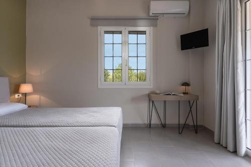 Cama o camas de una habitación en Lemonia Accommodations