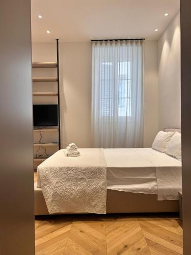 Postel nebo postele na pokoji v ubytování Palazzo Machiavelli Trieste