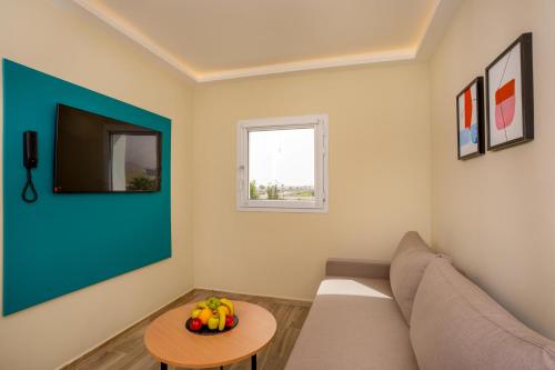 a living room with a couch and a table at MIA Urban Agadir in Agadir