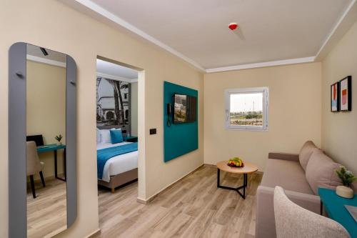 a living room with a bed and a couch at MIA Urban Agadir in Agadir