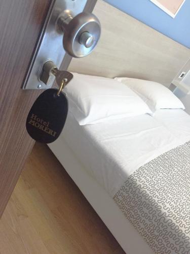 Postel nebo postele na pokoji v ubytování Hotel Moreri