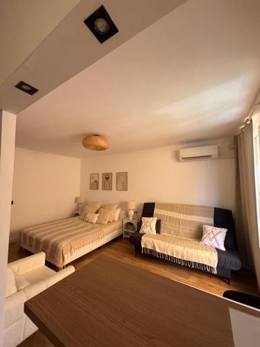 Postel nebo postele na pokoji v ubytování Spacieux studio proche gare