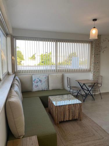 a living room with a couch and a table at סוד הנחלים in Sede Neẖemya