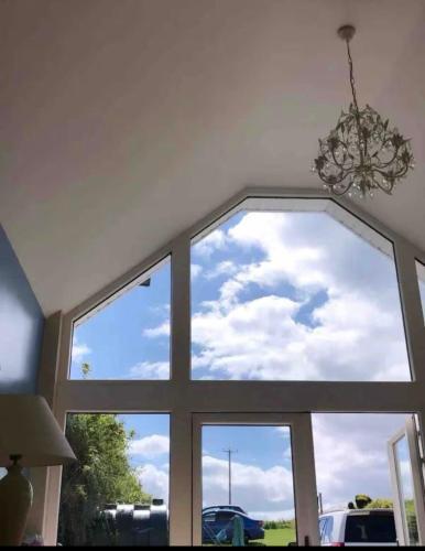 a window with a view of the sky through it at Enniscrone House in Enniscrone