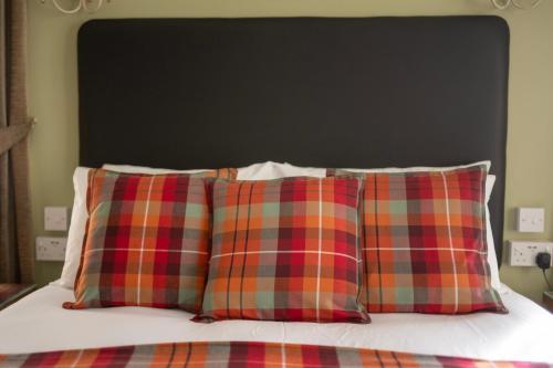 Ένα ή περισσότερα κρεβάτια σε δωμάτιο στο Eildon Guest House