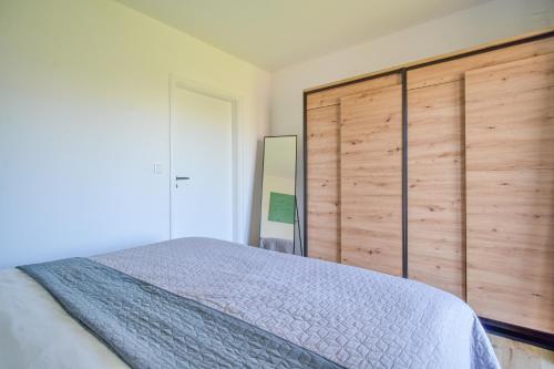 Katil atau katil-katil dalam bilik di Veselé Apartmány Lipno