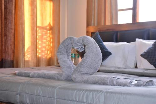 Ένα ή περισσότερα κρεβάτια σε δωμάτιο στο Summer Imperial Crest Hotels