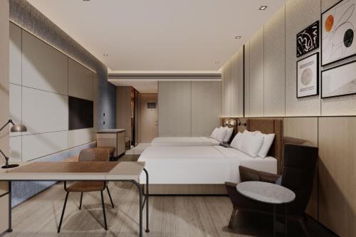 Ένα ή περισσότερα κρεβάτια σε δωμάτιο στο Four Points by Sheraton Yancheng, Jianhu