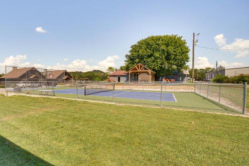 a couple of tennis courts in a park at Little Indian Resort Cabin Pool and Walk to Lake! in Lampe