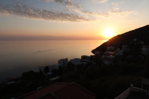 a sunset over the ocean from a hill at Captain's View in Dobra Voda