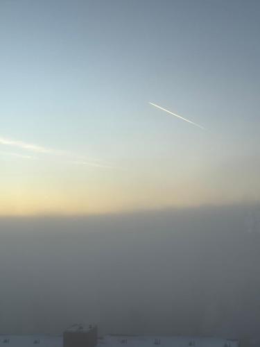 a kite flying in the sky over a city at Panoramic View Harz in Altenau