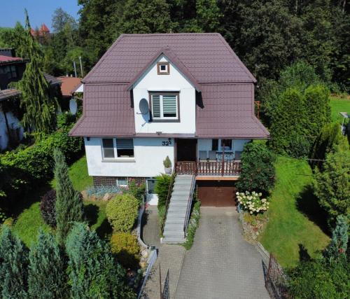 an aerial view of a house with a roof at Domek Żabie Oczko in Jarnołtówek