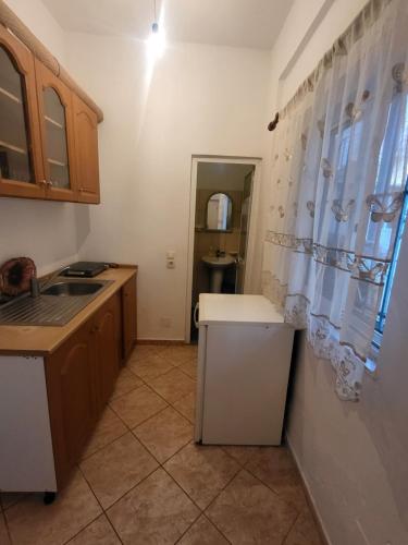 Η κουζίνα ή μικρή κουζίνα στο Melina rooms