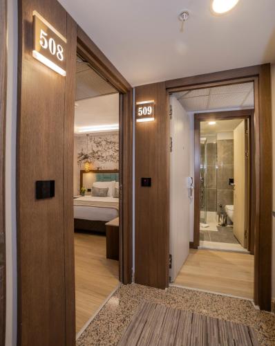 a hotel room with a sign that reads sos at Grand Hilarium Hotel in Istanbul