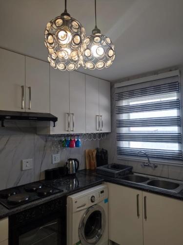 Η κουζίνα ή μικρή κουζίνα στο Elite Escape - 2 bedroom apartment