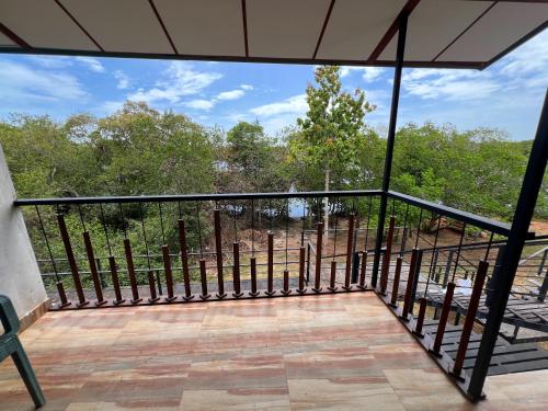 a view from the balcony of a house at Wilpattu Nature Resort in Murandanveli