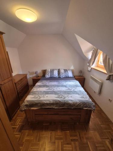 a bedroom with a bed in an attic at Marjetica 40 in Moravske-Toplice
