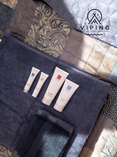a set of four products sitting on a bed at Bramslev Bakker Naturhotel in Hobro