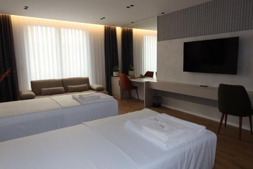 Una cama o camas en una habitación de Hotel Ari Gjakove