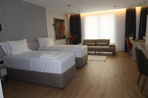 Una cama o camas en una habitación de Hotel Ari Gjakove