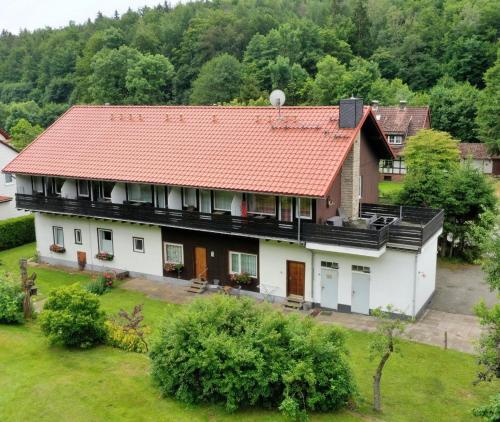 an aerial view of a house with a red roof at Ferienappartements Haus Jörn in Wieda