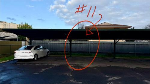 a white car parked in a parking lot at 2 Bdrm Walkerville Apartment - Spacious, ducted heating & cooling, centerally located! in North Adelaide