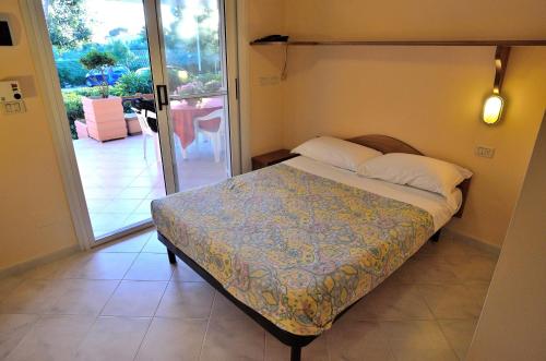 Ένα ή περισσότερα κρεβάτια σε δωμάτιο στο Blue Marine Village