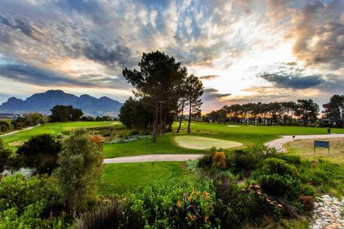 a view of a golf course with mountains in the background at La Paris Estate in Franschhoek