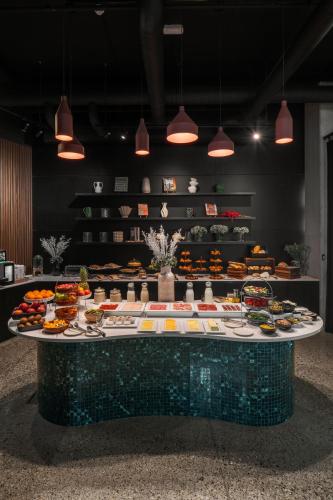 a table with many different types of food on it at Pullman Zagreb in Zagreb