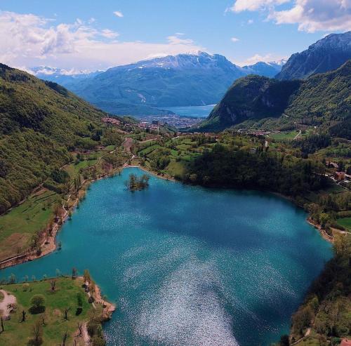 an aerial view of a lake in the mountains at Agritur Tenno Bio Natura in Tenno