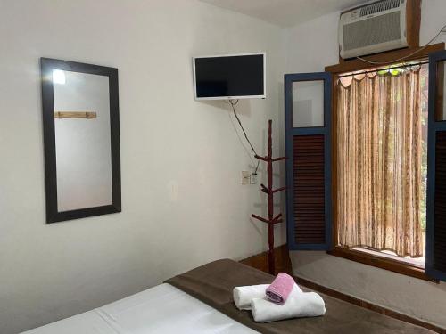 Katil atau katil-katil dalam bilik di Pousada & Hostel Bicho Preguiça