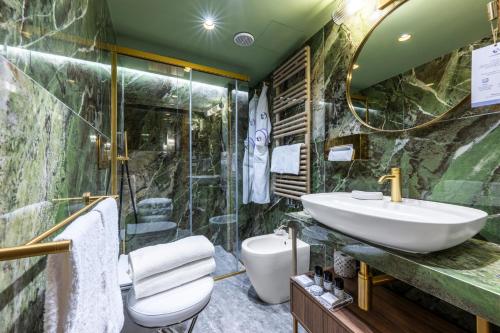 a bathroom with a sink and a shower at Hotel Colombina in Venice