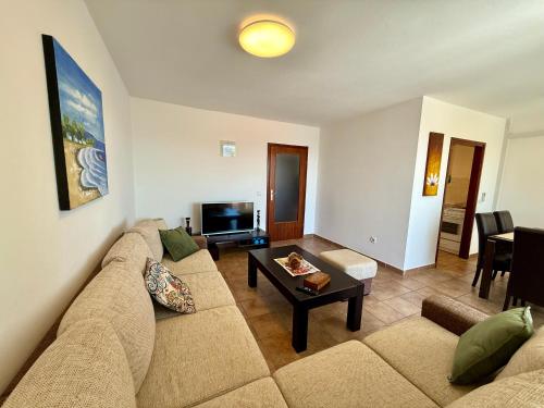 a living room with a couch and a coffee table at Apartman Val in Dramalj