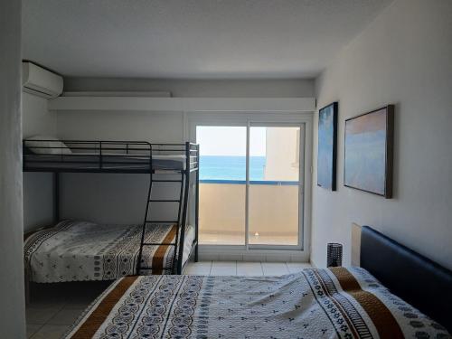 Postel nebo postele na pokoji v ubytování Le charme du Lydia Playa