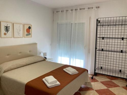 Ένα ή περισσότερα κρεβάτια σε δωμάτιο στο Sol Andaluz Plaza Castillo