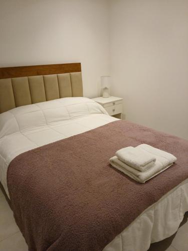 Postel nebo postele na pokoji v ubytování Departamento Studio Costa de Mar Río Grande - Tierra del Fuego