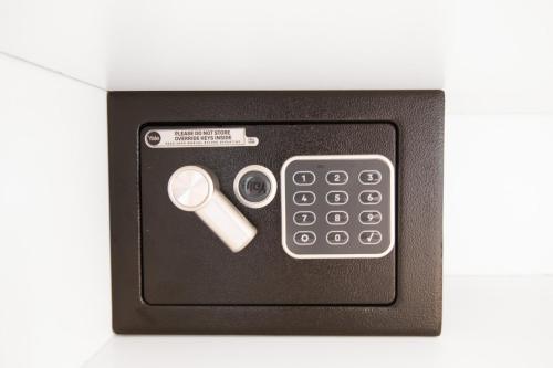 a box with a remote control and a calculator at 64 Sea Lodge Umhlanga Rocks in Durban