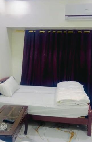 Katil atau katil-katil dalam bilik di Al Amarat Hotel Tariq Road