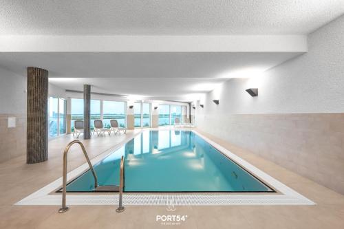 a pool in a hotel room with a swimming pool at Ferienwohnung Meermarie Olpenitz in Olpenitz