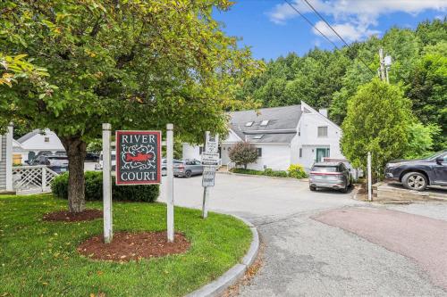 a street with a sign that says enter your own at Riverside Getaway in Stowe