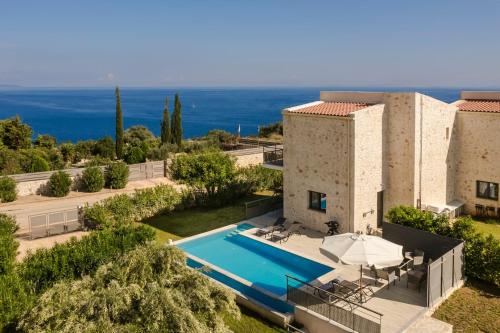 an aerial view of a villa with a swimming pool at Petradi Villa Skala I in Skala