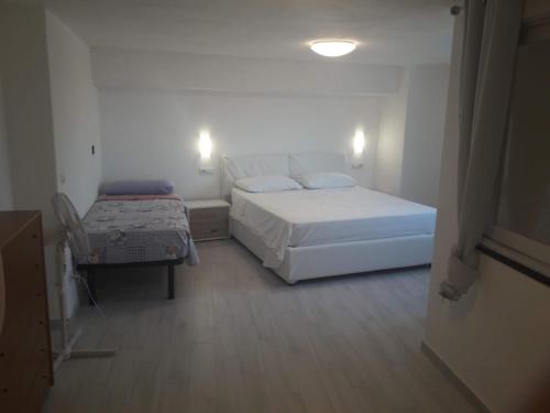 Ένα ή περισσότερα κρεβάτια σε δωμάτιο στο Cartaromana Residence