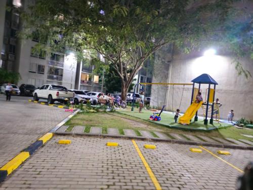 a park with a playground on a city street at Apartment near U San Buenaventura in Cartagena de Indias