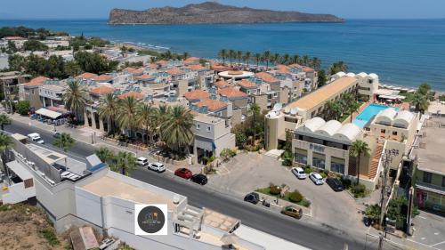an aerial view of a town next to the ocean at United Cretan Villas in Agia Marina Nea Kydonias