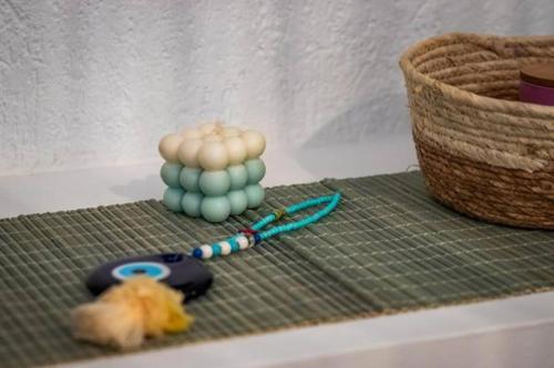 a toy on a shelf with a ball of yarn at Wood in White in Panormos Skopelos