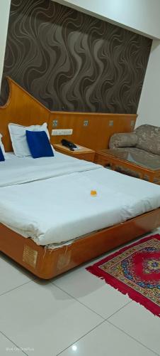 Cama o camas de una habitación en Kochar con by guruji hospitality
