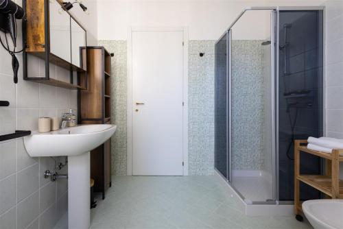 a bathroom with a sink and a shower at IseoLakeRental - Fuori Porta in Tavernola Bergamasca